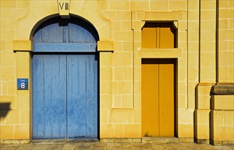 Gate and door of a restored historic warehouse building
