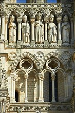 Gothic statues and the facade of the Amiens Cathedral