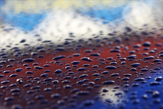 Raindrops on a car roof