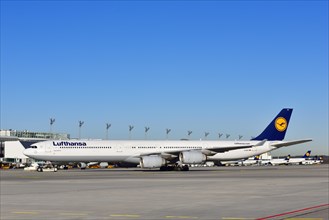 Lufthansa Airbus A340-600 with pushback truck