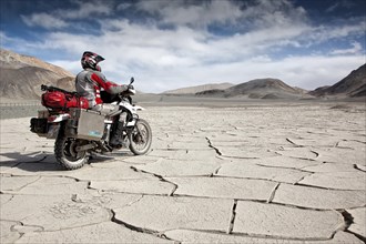 Motorcyclist travelling on the Pamir Highway