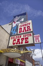 Advertising sign for Cowboy Bar