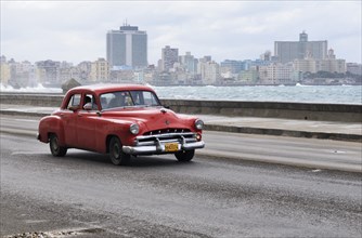 American vintage car travelling on the Malecon