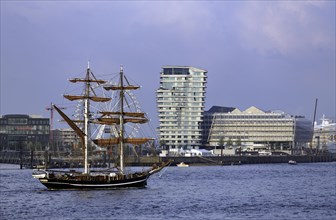 Historic sailing ship in front of esidential Marco Polo Tower and Unilever-Haus office building