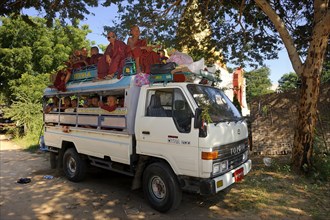 Buddhist child monks taking the school bus