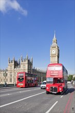 Red double decker buses on Westminster Bridge with Big Ben and Houses of Parliament