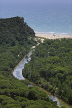 Drainage channel and a sandy beach in the Maremma Natural Park