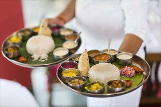 Chef with two South Indian Thalis