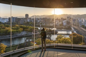 Woman looking from observation platform of Hiroshima Orizuru Tower