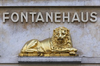 Golden lion and lettering ""Fontanehaus"" at the birthplace of the writer Theodor Fontane