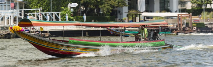 Colorful longtail boat on the Chao Phraya River