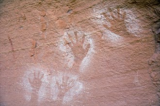 Ancient Anasazi hand pictographs on a cliff high above the Colorado River