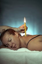 Woman being treated with a body candle