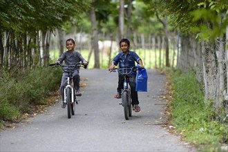Two boys on bicycles