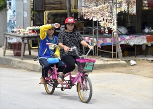 Two women riding a tandem