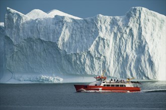 Disko Line ferry passing iceberg