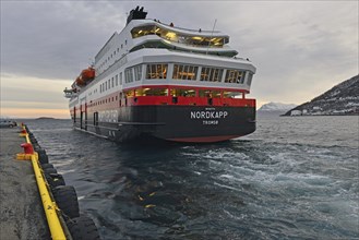 MS Nordkapp departing from the pier towards Vagsfjord