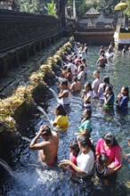 People doing ritual ablution in the Tirta Empul Water Temple