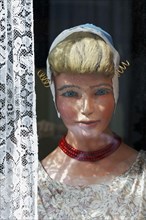 Display dummy in Dutch traditional costume in a window