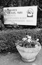 Flower pot and agitation poster for the Karl-Marx-year 1983 at the roadside