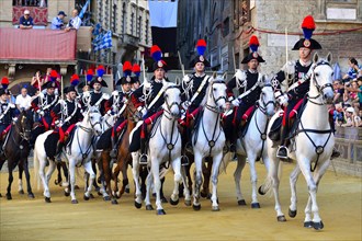 Mounted dragoons at a parade before the historical horse race Palio di Siena