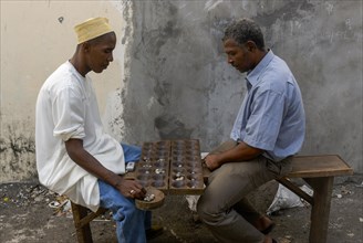 Men playing Mancala