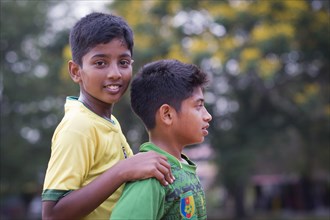 Two boys during a short break at a football game