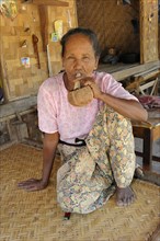 Burmese woman smoking a cheroot