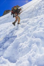 Mountaineer abseiling from Mt Col Blanc to the Plateau du Trient