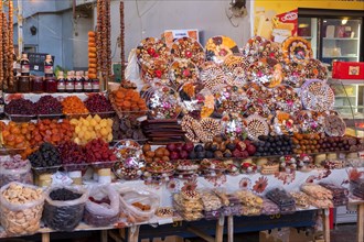 Stall in market hall with candied fruits