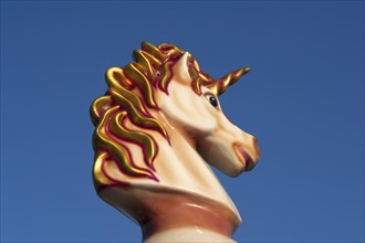 Unicorn figurine on a children's carousel
