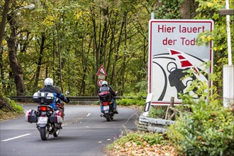 Danger sign for motorcyclists on a road in southern Essen