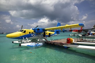 Seaplanes at the pontoon of Kuredu Island