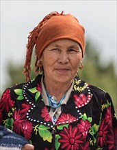 Portrait of a Uzbek woman wearing a headscarf