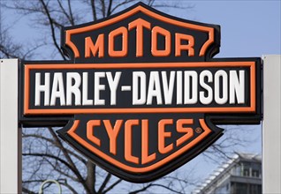 Company sign and the logo of Harley Davidson