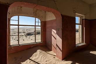 Room in a house now covered with sand