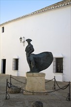 Statue of a bullfighter in front of the bullring