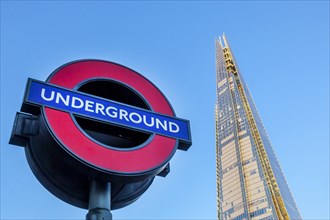 The Shard skyscraper and sign of the London Underground