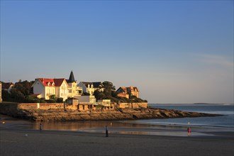 Houses by the sea in the evening light