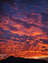 Silhouette of Rosskogel mountain with dramatic evening clouds