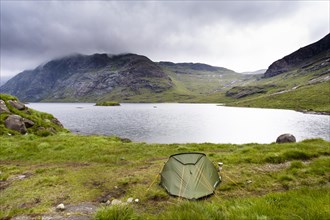 Tent next to Loch Coruisk with Cuillin Hills behind