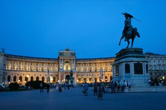 Hofburg Palace at Heldenplatz square with the equestrian monument of Archduke Charles