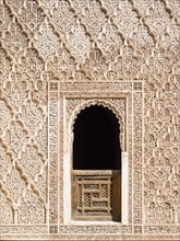 Ornate wall reliefs in the Ben Youssef Madrasa