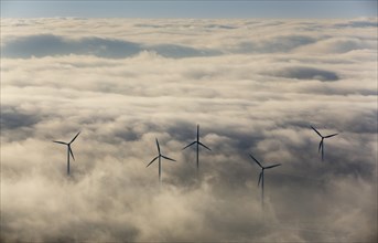 Wind power plants surrounded by clouds