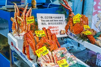 Prawns for sale and raw consumption at a market
