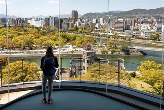 Woman looking from observation platform of Hiroshima Orizuru Tower