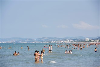 Tourists bathing in the sea