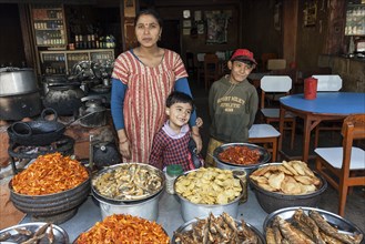 Nepalese restaurant with cooker and displayed food