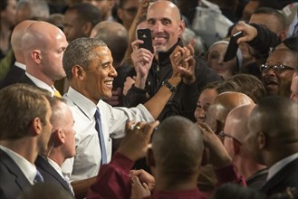 President Barack Obama shakes hands following a speech at Ford's Michigan Assembly Plant
