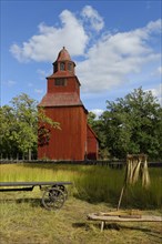 Wooden red Seglora Church or Seglora kyrka